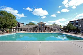 Bloomingdale apartment for rent - a swimming pool with a building in the background